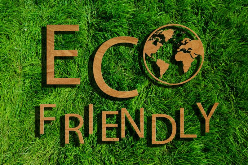 green lawn with wooden Eco Friendly sign